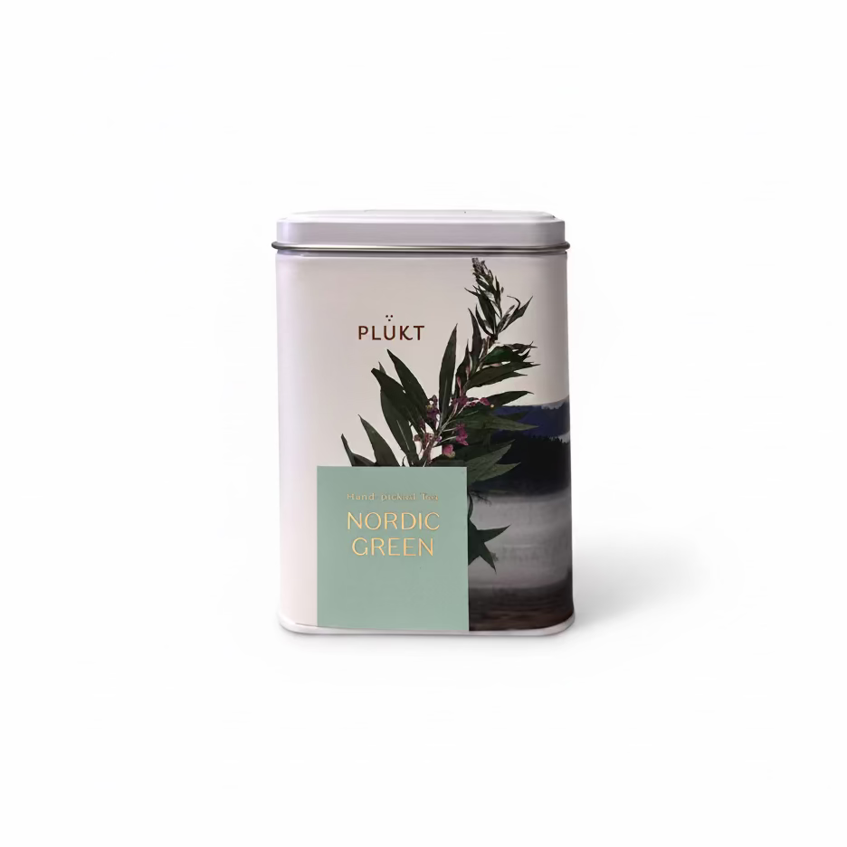 A cylindrical metal tea tin for Plükt &